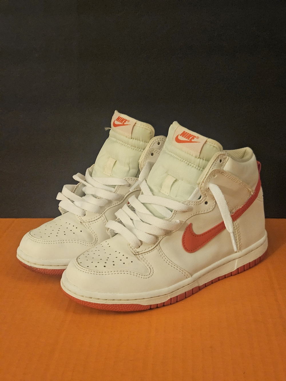 Nike Women’s Mid-Top Sneakers in White with Red Swoosh